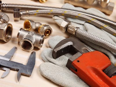 Set of plumbing and tools on the table.